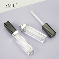 Tube de brillant à lèvres applicateur à grande tête de brosse carrée noire transparente pour corps de bouteille