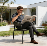 Chaise de salle à manger d'extérieur en acier noir moderne, légère et durable, avec un design écologique pour une utilisation en jardin