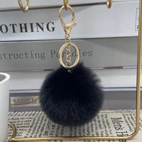 Vente en gros 8cm pompon multicolore fourrure mignon sac pendentifs porte-clés clé de voiture accessoires fausse fourrure de lapin boule Pom Pom porte-clés