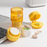 Mini déchiqueteuse de coupe-pilule en plastique portable avec organisateur de boîte de rangement ronde Matériau PP pour une gestion pratique des pilules