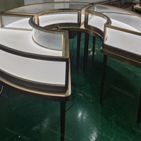Comptoir de présentation de bijoux en verre rond de luxe personnalisé avec éclairage LED, îlot central, vitrine modulaire, table de présentation commerciale, kiosque à montres et bijoux