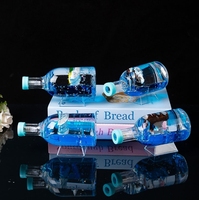 Décoration de table en forme de bouteille flottante lumineuse avec bateau à voile, bouteille ronde avec gouttes d'huile flottantes, porte-stylo pour étudiant, cadeau d'anniversaire