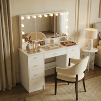 Vente en gros de bureau de maquillage en MDF blanc avec miroir triple éclairé, plateau en verre et 9 tiroirs