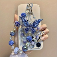 Breloque de téléphone papillon bleu foncé avec gros strass et perles, lanière de poignet pour sac, bijou artisanal lourd, cadeau pour femme