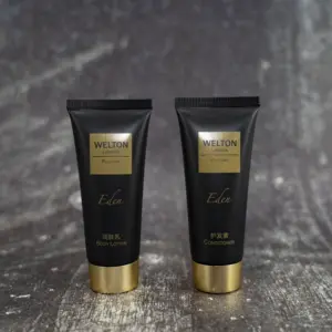 Özel ambalaj logosu plastik kozmetik siyah yuvarlak sıkılabilir tüp altın kaplama ile vidalı kapak vücut losyonu duş jeli şampuan için