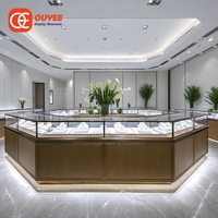 Vitrine d'îlot commerciale en métal pour bijoux, présentoir de comptoir doré pour bijouterie