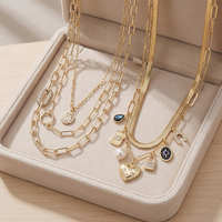 Collier superposé personnalisé pour femme, chaîne serpent dorée, pendentif cœur, breloque étoile colorée, bijoux de mode OEM ODM