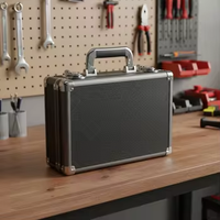 Valise à outils en aluminium noir grande capacité, durable, résistante à l'eau, aux chocs et à la poussière, verrouillable, portable, personnalisable OEM ODM