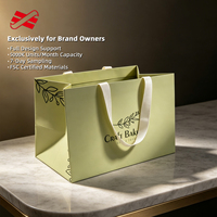 Sac en papier vert pâle personnalisé avec poignée en ruban gros-grain et imprimé feuilles pour la vente en gros aux boulangeries