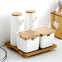 Ensemble de condiments japonais pour bouteilles d'huile ménagers boîte d'assaisonnement moderne et simple en céramique avec couvercle et plateau en bois