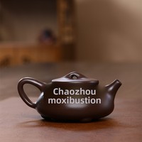 Théières en céramique d'argile violette de Yixing en gros - Artisanat domestique avec motif « Le ciel récompense la zérité », nouveau style chinois