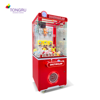 Machine à griffes transparente rouge avec poupées et capsules pour cinéma, machine de jeu à griffes à monnayeur