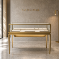 Vitrine à bijoux sur pied haut de gamme couleur or champagne, style musée moderne avec éclairage LED et dessus en verre verrouillable