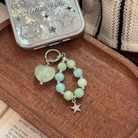 Porte-clés sirène pastel perlé avec breloque cœur aurore et pendentif étoile en strass, accessoire de poignet pour sac