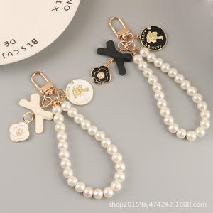 Nouveau arc porte-clés pendentif mignon perle chaîne beauté tête métal rond étiquette accessoires sac décoration - Product Image 3