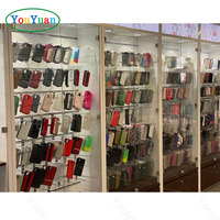 Vitrine murale pour téléphone portable avec logo personnalisé OEM, vitrine en verre LED pour accessoires électroniques, magasin d'accessoires électroniques