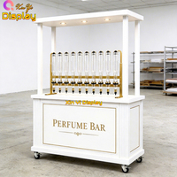 Kiosque de présentation de parfums LED de luxe avec finition blanche, vitrine mobile pour les magasins de détail et les magasins de cosmétiques, design écologique