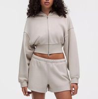 Ensemble de survêtement deux pièces pour femme, comprenant un sweat à capuche zippé oversize court et un short de survêtement assorti, en molleton doux, idéal pour la détente