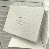 Boîte cadeau magnétique pliable en carton gris avec motif floral en relief personnalisé pour crème et essence de luxe