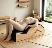 Équipement de fitness de haute qualité en gros, correcteur de colonne vertébrale noir pour Pilates avec une réduction pour les exercices à domicile et en studio