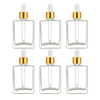 Flacon compte-gouttes en verre transparent de 50 ml (1,7 oz) pour sérum, huile essentielle, soin du visage et du corps, avec compte-gouttes doré