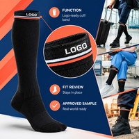 Chaussettes de compression noires avec logo, support du mollet à compression graduée, bordure large, pointe plate, avec tableau de mesure, vérifiées pour le travail