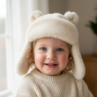 Chapeau trappeur pour enfants en fausse fourrure blanc crème, doux et moelleux, avec oreilles d'ours, confortable et chaud, mignon pour les vacances d'hiver et les jeux en plein air