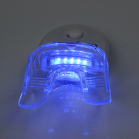 Vente en gros CE dentaire à la maison 2022 Kit de blanchiment des dents UV Logo privé Kit de blanchiment des dents professionnel avec lumière LED