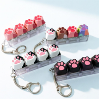 Porte-clés pendentif patte de chat colorée et mignonne, jouet anti-stress imprimé patte de chat, clavier à boutons pour sac à dos