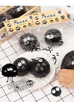 Jouet à presser noir en caoutchouc souple, jouet sensoriel anti-stress mignon à yeux croisés