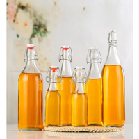 Vente en gros du fabricant Bouteilles d'eau transparentes de 750ml 1000ml à couvercle rabattable avec bouchon hermétique