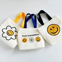 Sac à main mini en toile motif visage souriant pour l'été 2026 – Sac fourre-tout décontracté et tendance pour femme, petit sac à main en toile pour usage quotidien