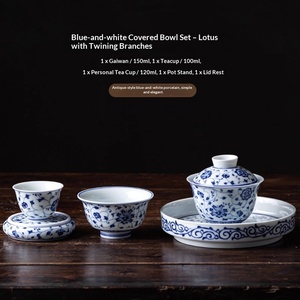 Juego de Té de Cinco Piezas de Cerámica con Tazón, Taza, Tapa, Portavasos, Diseño de Ramas Entrelazadas y Loto, Color Azul y Floral, Acabado Subesmaltado - Product Image 1