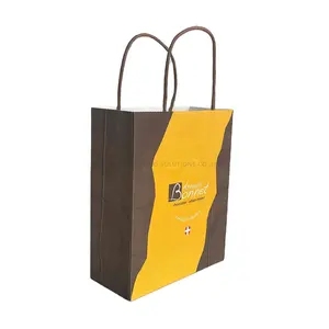 Bolsa de papel Kraft amarilla y marrón chocolate reciclable duradera personalizada con borde de corte ondulado y mango trenzado marrón para tienda de chocolate