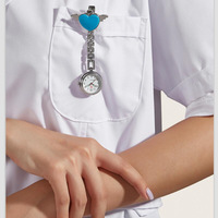 Nouvelle montre infirmière portable en acier inoxydable, motif cœur d'ange, à quartz, pour femme, avec clip broche, montre à accrocher pour médecin, chiffres arabes