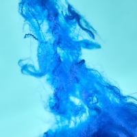 Fibre de polyester recyclée 1.5D*38mm, ignifuge, douce, creuse et conjuguée pour le filage, le textile de maison et le rembourrage de coussins