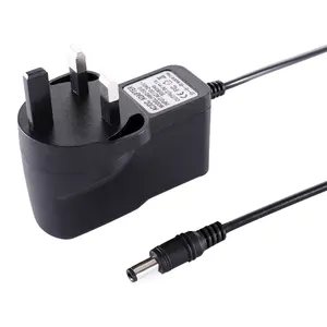 Nhà sản xuất trực tiếp 9v1a chúng tôi EU Anh Power Adapter 9v1a chuyển đổi chế độ cung cấp điện AC DC cắm Adapter