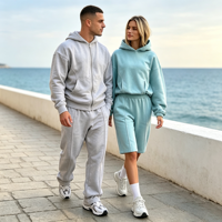 Ensemble de survêtement unisexe Kuest personnalisé gris avec sweat à capuche zippé oversize et pantalon de jogging long, idéal pour l'hiver et les loisirs