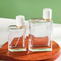 Bouteille de parfum en verre transparent rectangulaire unique de 100ml vide pour diffuseur de parfum pour femme avec pulvérisateur à pompe pour cadeau