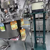 Machine de remplissage et de scellage automatique Zhongjie pour sachets à bec verseur (doypacks) pour l'emballage de liquides, sauces, beurre et pâtes (Ketchup, etc.)