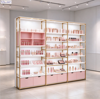 Vitrine de présentation de maquillage et cosmétiques éco-responsable avec éclairage LED et cadre doré, personnalisable pour la vente au détail