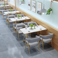 Meubles de restaurant d'art en fer de luxe léger usine de Foshan café commercial canapé contreplaqué ensemble table et chaises en marbre