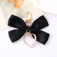 Pendentif de chaîne de téléphone papillon élégant pour femmes, sacs et valises, breloque en perles faites à la main, avec nœud d'amour