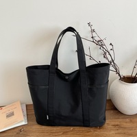 Sac fourre-tout en toile épaisse à surface unie et design épuré pour l'école et les trajets quotidiens