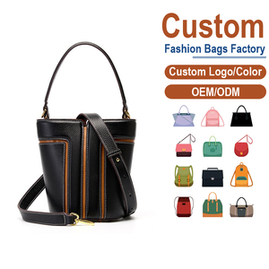 กระเป๋าถือหนังแท้สีดำสำหรับผู้หญิง รุ่นสปริง บัคเก็ต ป้องกันการโจรกรรม ผิวสัมผัสลายก้อนกรวด แต่งขอบสีคาราเมล เย็บด้ายสีขาว เหมาะสำหรับใส่ลำลอง - Product Image 2