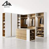 Système de dressing modulable avec rails, étagères, tiroirs, îlot central et organisateur de rangement pour chaussures, idéal pour la chambre à coucher