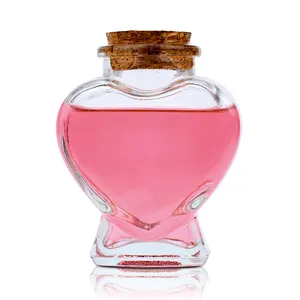 wholesale refillable mini liquor bottles 70ml heart shaped decoration perfume glass bottle with cork