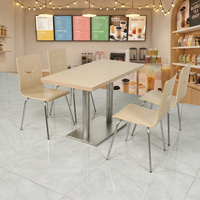 Ensemble table et chaises de cafétéria simple avec cadre en acier inoxydable et finition en bois naturel Mobilier de salle à manger durable pour restaurant