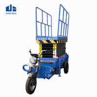 Tricycle de conduite à batterie électrique Plate-forme élévatrice aérienne Élévateur à ciseaux électrique mobile pour la construction