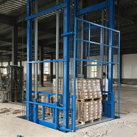 Plateforme élévatrice verticale hydraulique sur rail pour la manutention de marchandises en gros en entrepôt